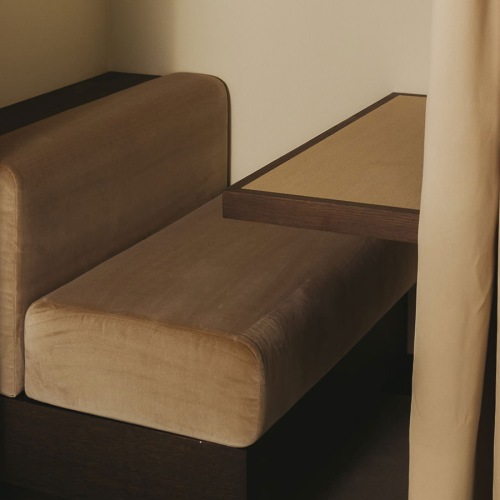 curtained booth with table and cushioned bench