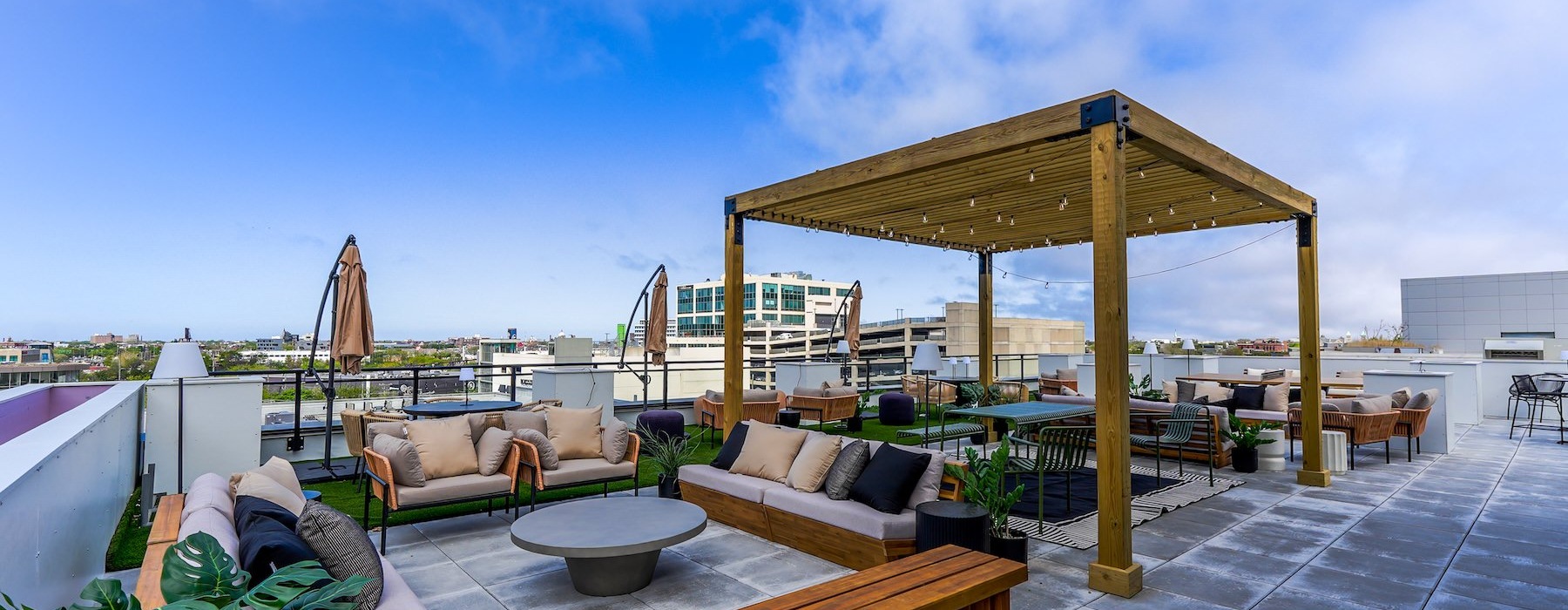 rooftop patio with seating and umbrella